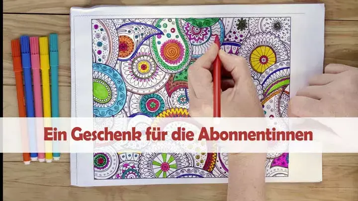 Hand mit Bunstift beim Ausmalen eines Ausmalbildes